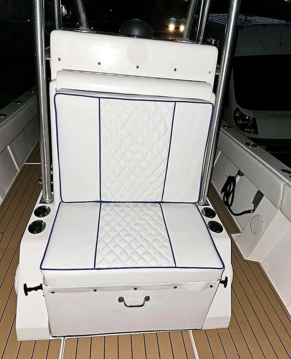 Rebuilt leaning post seat with quilted diamond stitching and navy piping
